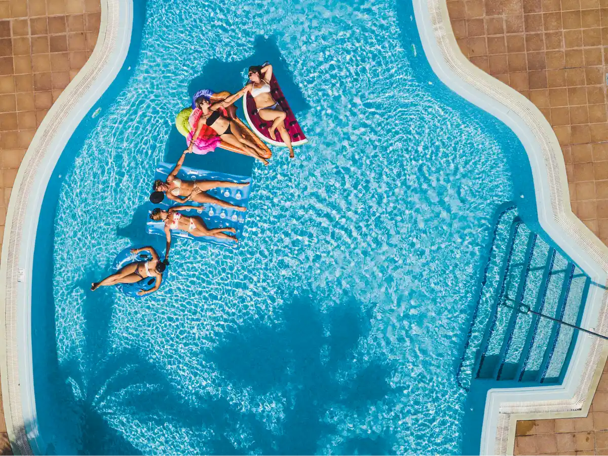 Group of women floating in pool