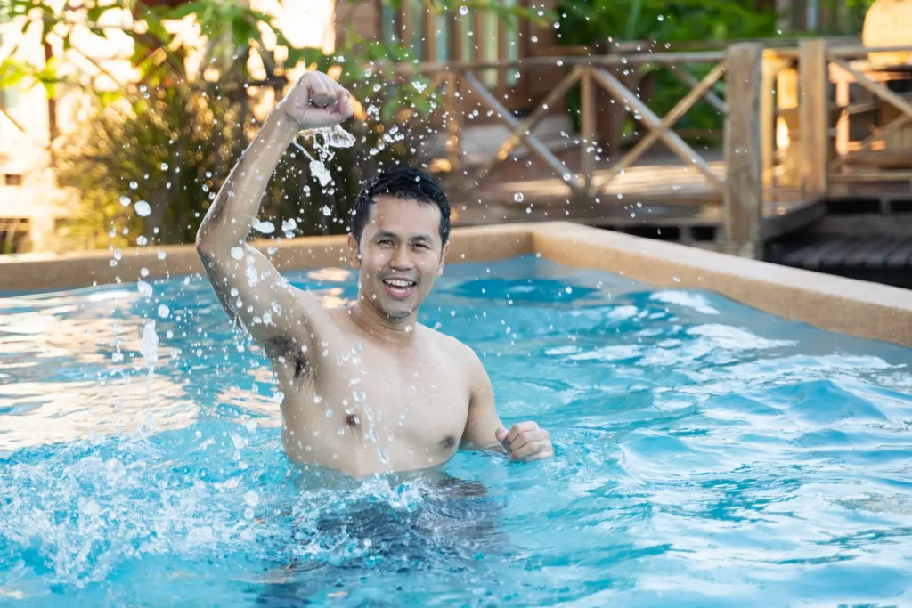 Man exercising in swimming pool